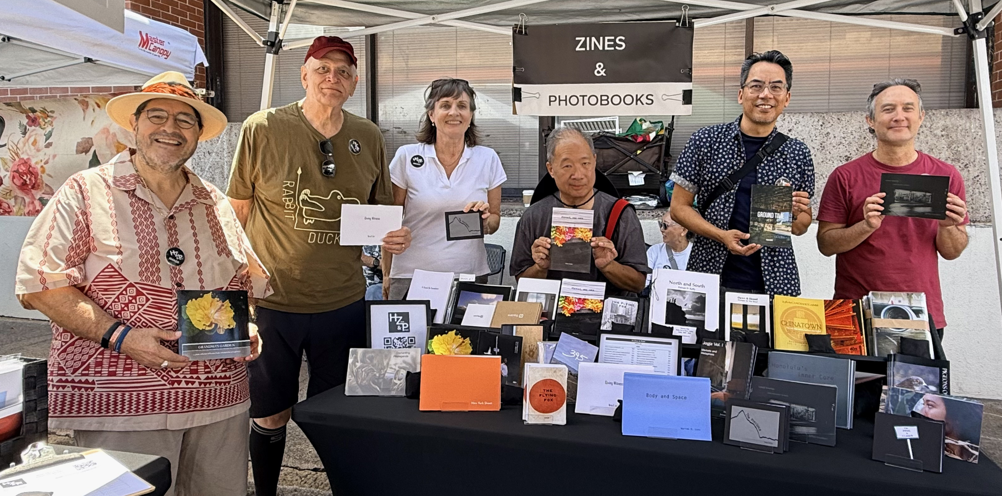 Members tabling at Contemporary Photography in Hawai‘i, Downtown Art Center